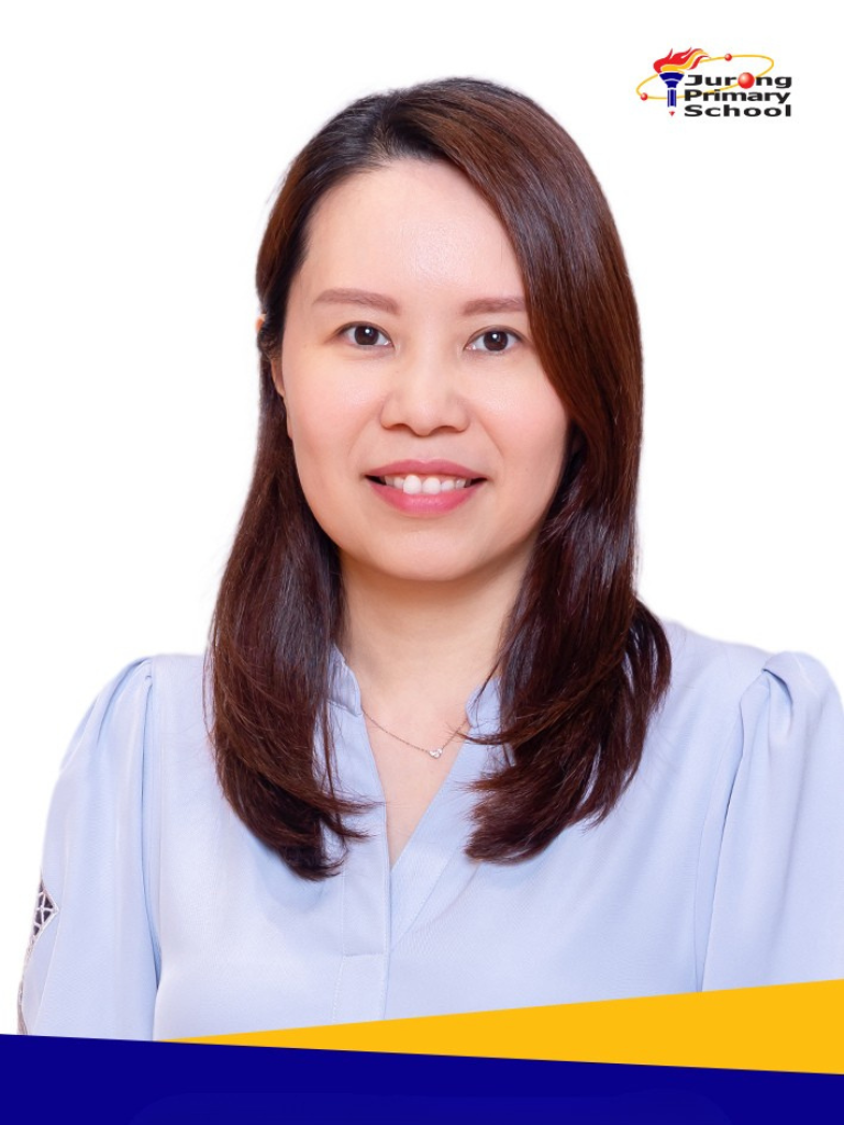 Smiling woman in light blue blouse, long dark hair, delicate necklace